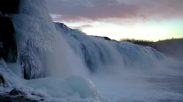Icy Faxi Waterfall In The Golden Circle Iceland - panning medium shot