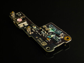 Water damaged electronic PCB board from a mobile phone, showing the effects of the gadget after it...