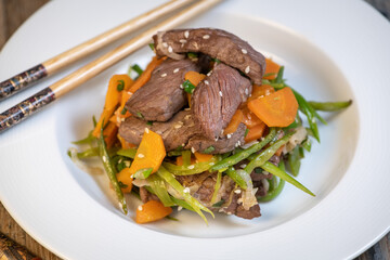 Preparing Recipe Sesame beef wok, minced summer vegetables