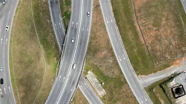 Aerial top down view of roundabout road network with traffic movement at Petra Jaya, Kuching, Sarawak