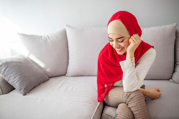 Portrait of a beautiful smiling muslim woman wearing hijab. Smile From The East. Woman in...