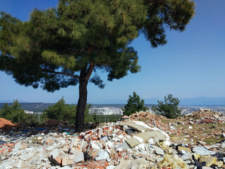 Construction waste left in heaps in the forest at the view point from Masada over Antalya resort...