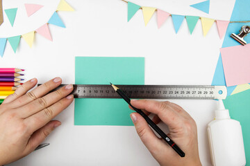 Step-by-step instructions for making a bunny box from colored paper. Step 2 - markup the template.