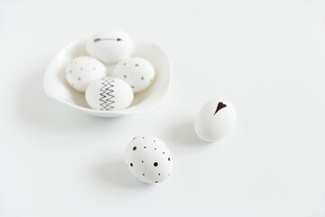 Painted eggs for Easter. Black and white, minimalist trendy style. Simplicity. White background