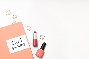 Lettering "Girl Power" on a pink diary on a white background