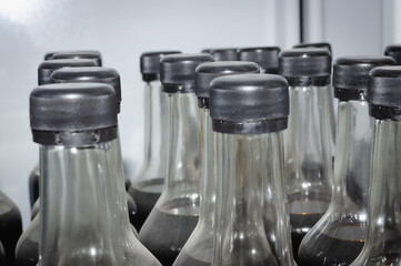 Glass bottles with black caps.