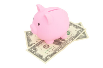 Piggy bank on money isolated on white background. Investment and savings concept.