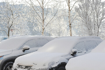 cars in the snow on a sunny winter day