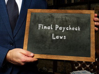 Business concept about Final Paycheck Laws with sign on chalkboard.