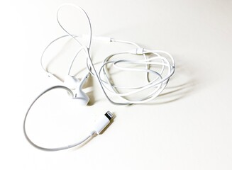 White headphones on the white background