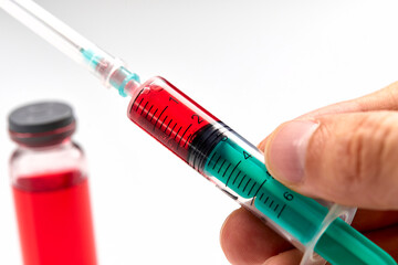 Naklejka premium Vaccine in vial with syringe