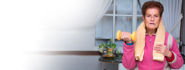 Portrait of senior woman exercising with dumbbells