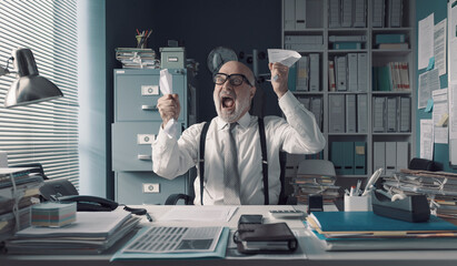 Stressed businessman shouting in the office