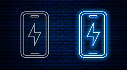 Glowing neon line Smartphone charging battery icon isolated on brick wall background. Phone with a low battery charge. Vector.