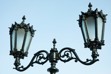 Fototapeta na wymiar Lamp post with two lanterns against clear sky