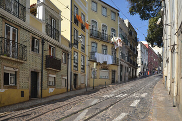 Fototapeta na wymiar The beautiful residential area of Lisbon, with old buildings and quite street.