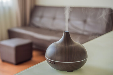 Aromatherapy Concept. Wooden Electric Ultrasonic Essential Oil Aroma Diffuser and Humidifier. Ultrasonic aroma diffuser for home