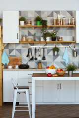kitchen close up fragment with pot plants, utensils, peas and beans in container