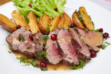Tasty roasted pork meat with potatoes