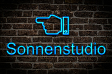 Fototapeta premium Leuchtreklame Sonnenstudio