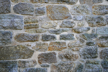 Steinwand als Hintergrund. Mauer aus natürlichen Steinen.