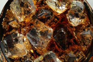 Fresh cola with ice cubes, close up