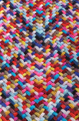 Fototapeta na wymiar A braid of multi colored sewing threads, photo stacking