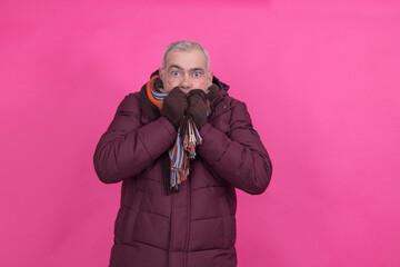 attractive senior man wearing anorak and scarf with background © tetxu