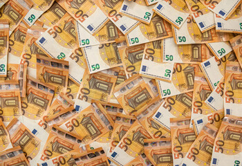 Business, finance, wealth 50 euro bills as background