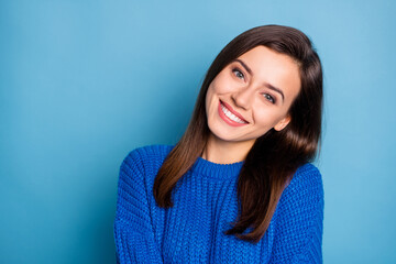 Portrait of young lovely pretty dreamy good mood cheerful positive girl smiling on camera isolated on blue color background