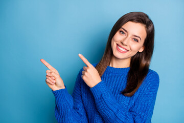 Portrait of young attractive happy positive good mood girl smiling pointing finger copyspace...