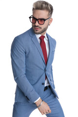 cool handsome businessman walking one way