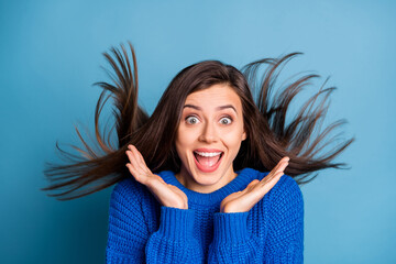 Portrait of young happy crazy shocked amazed smiling girl with flying hair hear news isolated on...