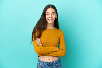 Young French woman isolated on blue background keeping the arms crossed in frontal position