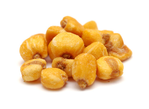 Large yellow salted corn nuts isolated on white background