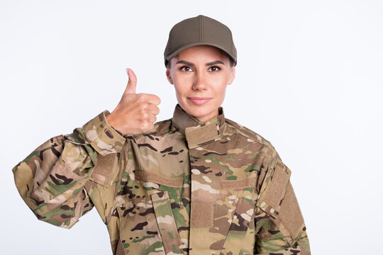 Photo of young woman soldier officer army show thumb-up like cool advert advice isolated over white color background
