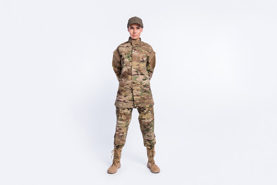 Full body photo of young woman confident soldier officer army camouflage uniform isolated over white color background