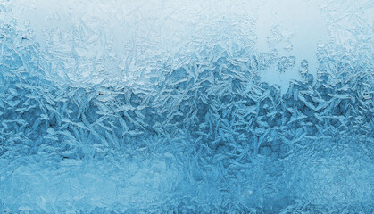 Fototapeta na wymiar Beautiful ice patterns on winter window