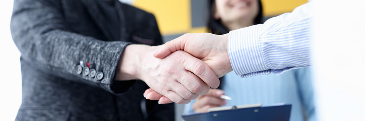 Fototapeta na wymiar Closeup of business partners handshake in office