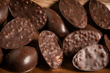 Close up of mini halves of crunchy easter eggs on a wooden basket.