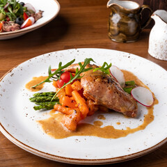 Stewed rabbit leg with vegetables
