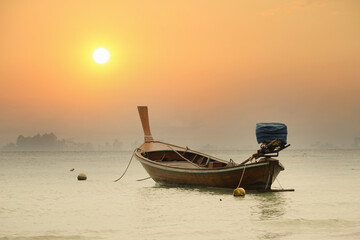 Beautiful boat on a lake in the beautiful red light sunset