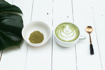 matcha latte on wooden background