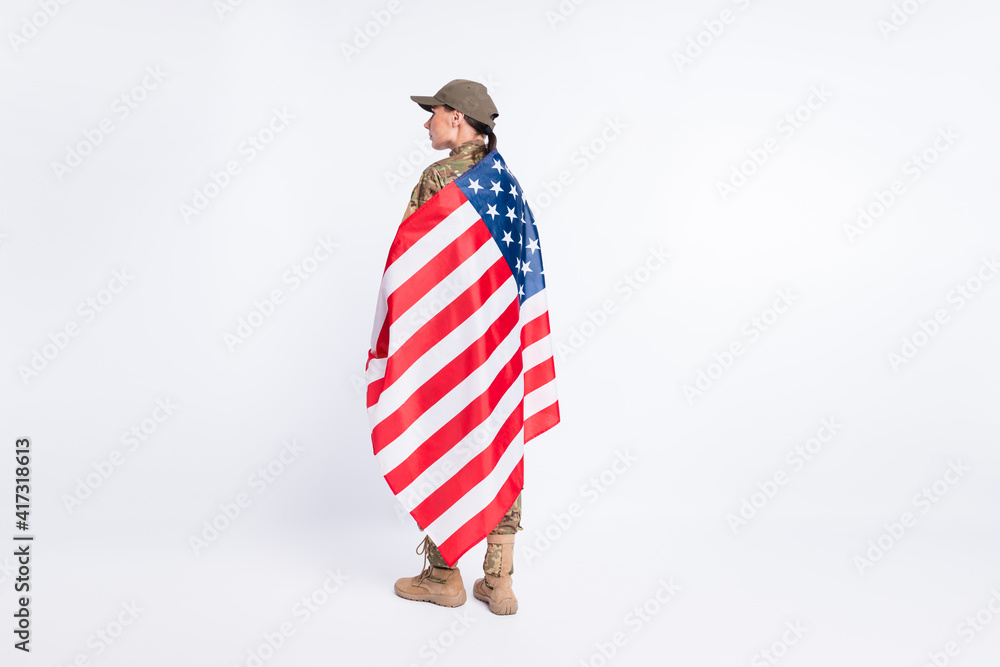 Wall mural Full body rear portrait of lady standing hold flag on shoulders look empty space isolated on white color background