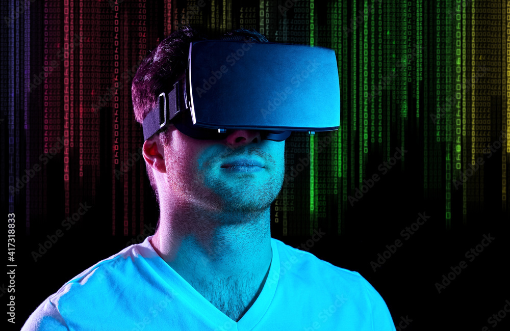 Wall mural 3d technology, virtual reality and programming concept - young man in vr glasses playing game over u