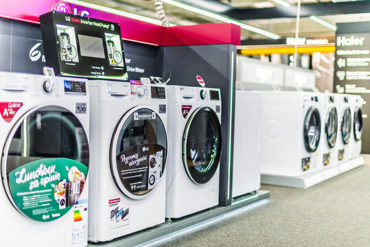 Front-loader washing machines by LG put up for sale in a household goods store