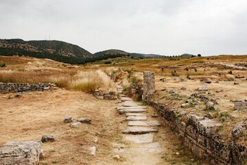 rocky path in the mountains leading up, sunny day