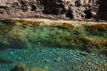 Gran Canaria, calm natural seawater pools in under the steep cliffs of the north coast and separated from the ocean by volcanic rocks,
Sardina del Norte area
