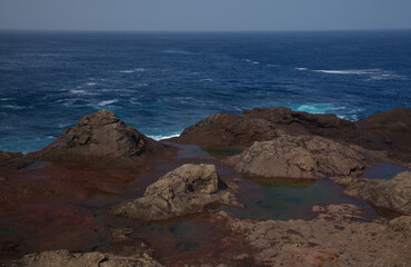 Gran Canaria, calm natural seawater pools in under the steep cliffs of the north coast and separated from the ocean by volcanic rocks,
Sardina del Norte area
