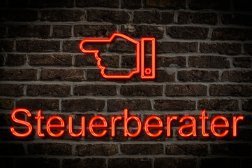 Fototapeta premium Leuchtreklame Steuerberater